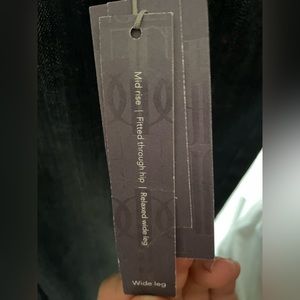 Jennifer Lopez Wide legged, blue jeans.